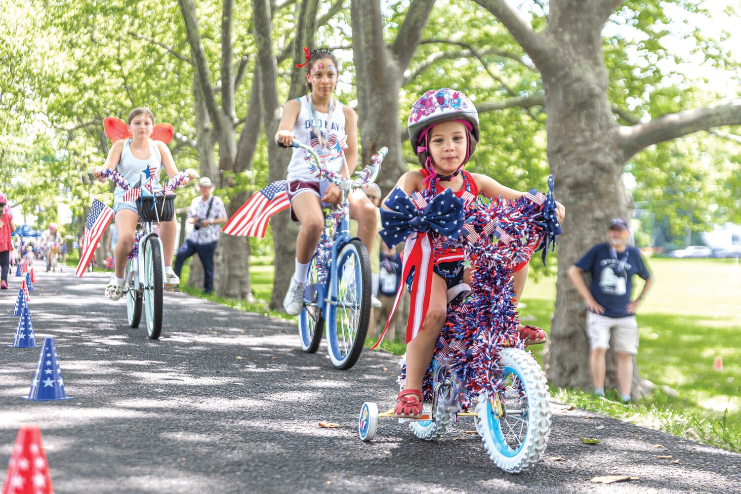 Children take part in a July 4th decorated bike parade at Fonthill.