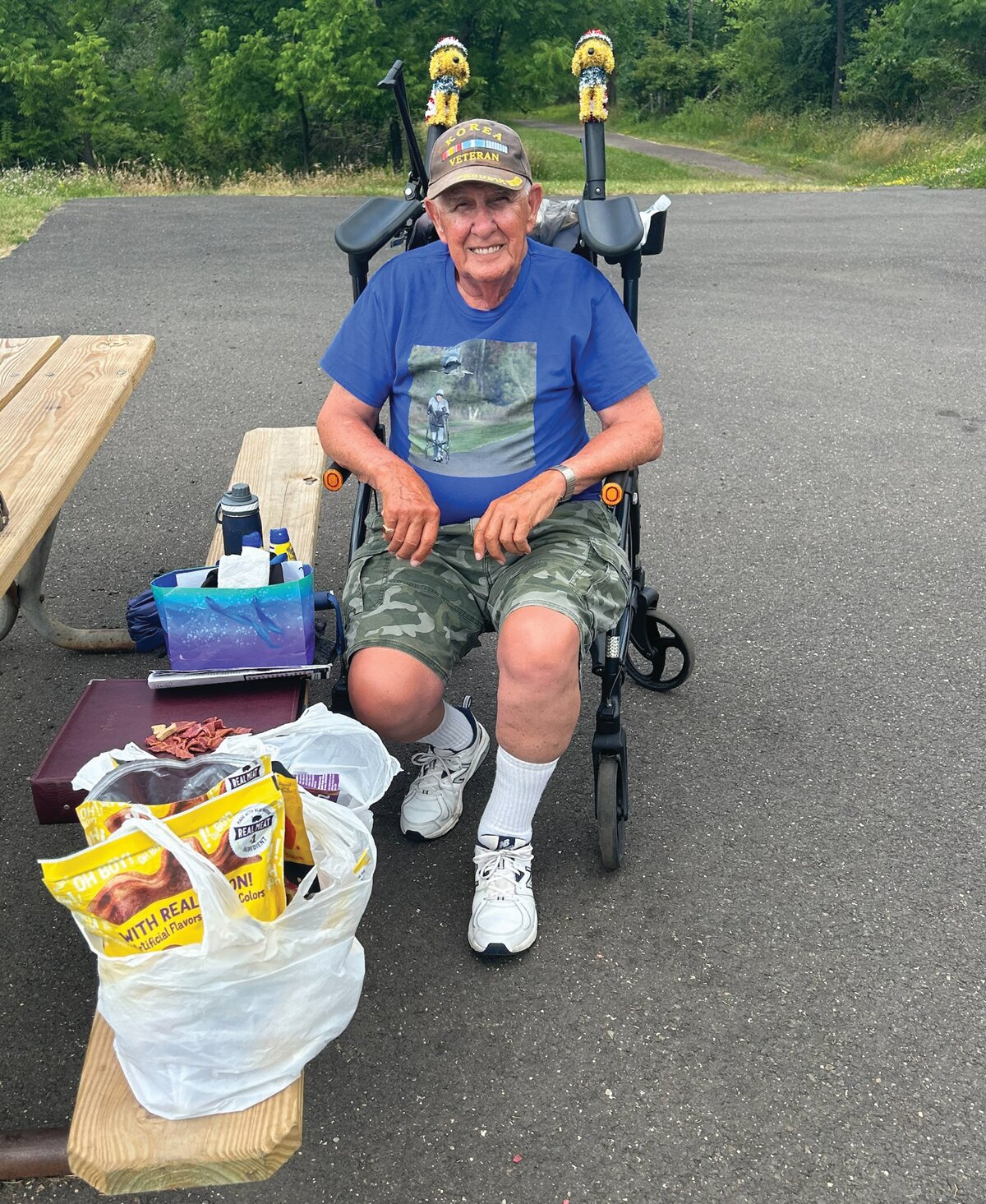 Joel Occhiuzzo relaxes between visits from Peace Valley Park-goers and their dogs on a recent morning in New Britain Township.