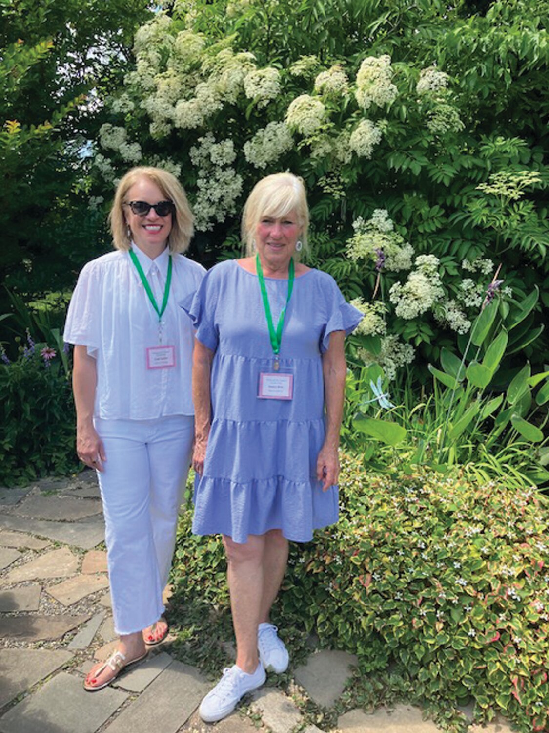 Garden host Nancy Deni, right, with her sister, Leah Socker.