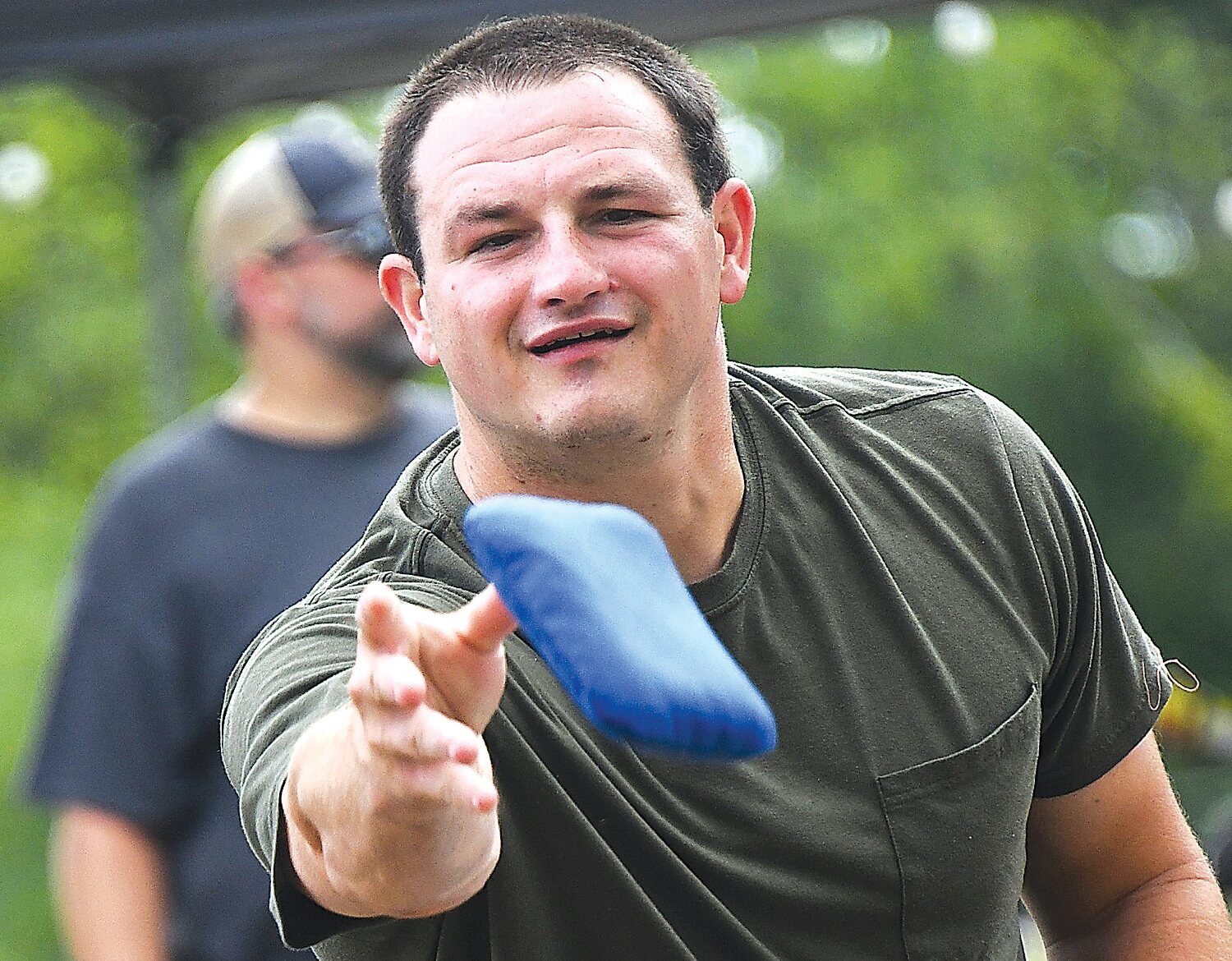 Andrew Cikanovich tosses a bean bag.