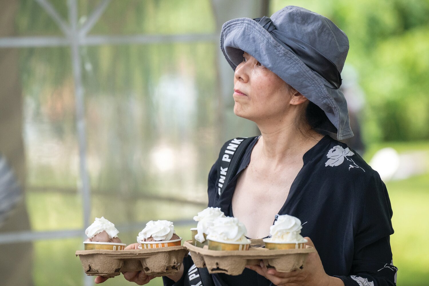 A visitor carries cold treats at Fonthill Castle’s Independence Day celebration July 4.