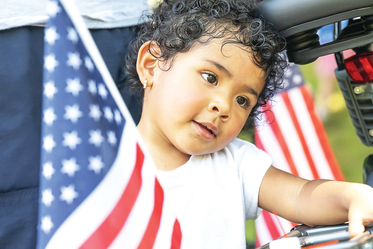 Eliana Anazgo, 20 months old, rests on her bike under the shade to escape the heat during Fonthill Castle’s annual Fourth of July old-fashioned celebration.