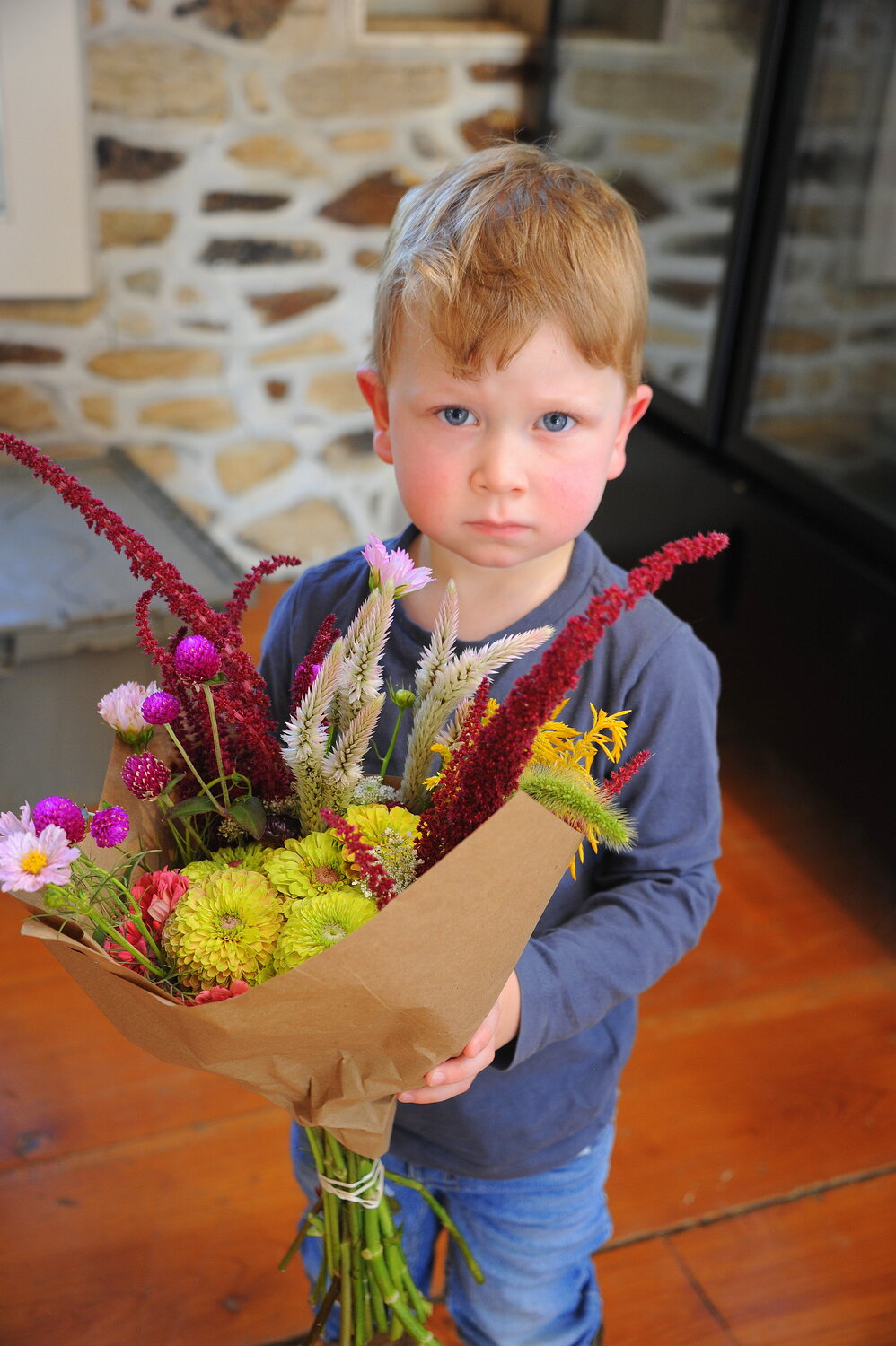 Lincoln Seelig hold a bouquet.