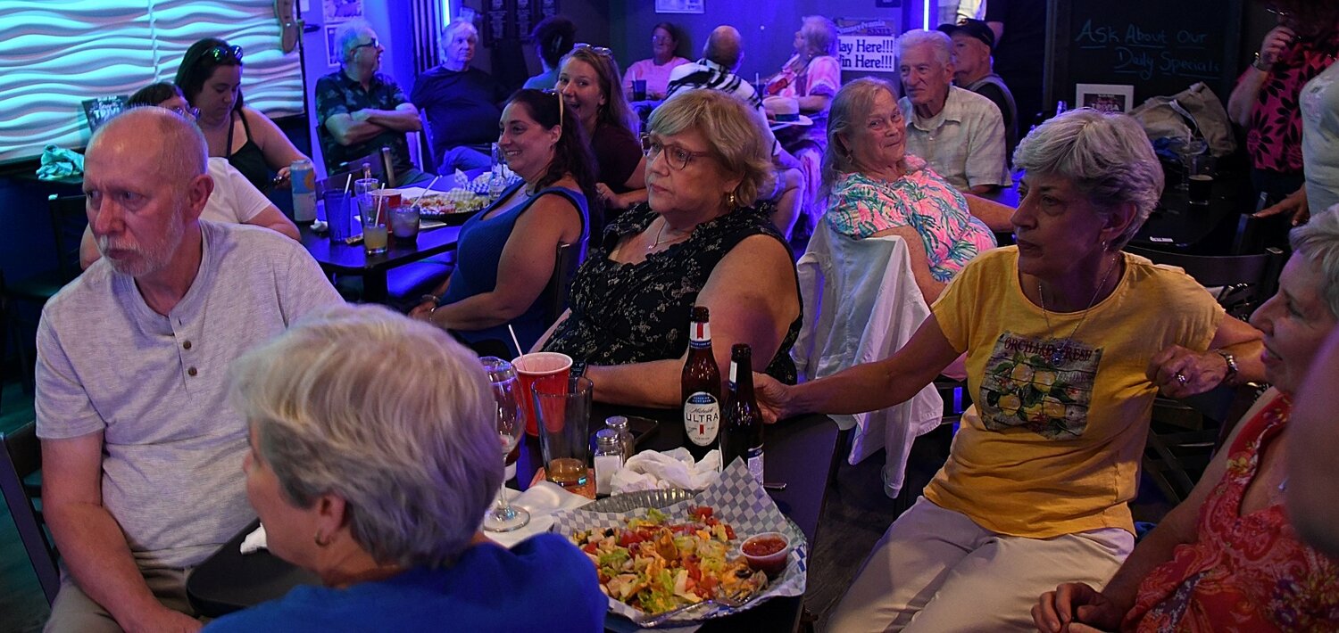 Folks enjoy food and drinks at the Warminster Food Bank fundraiser.