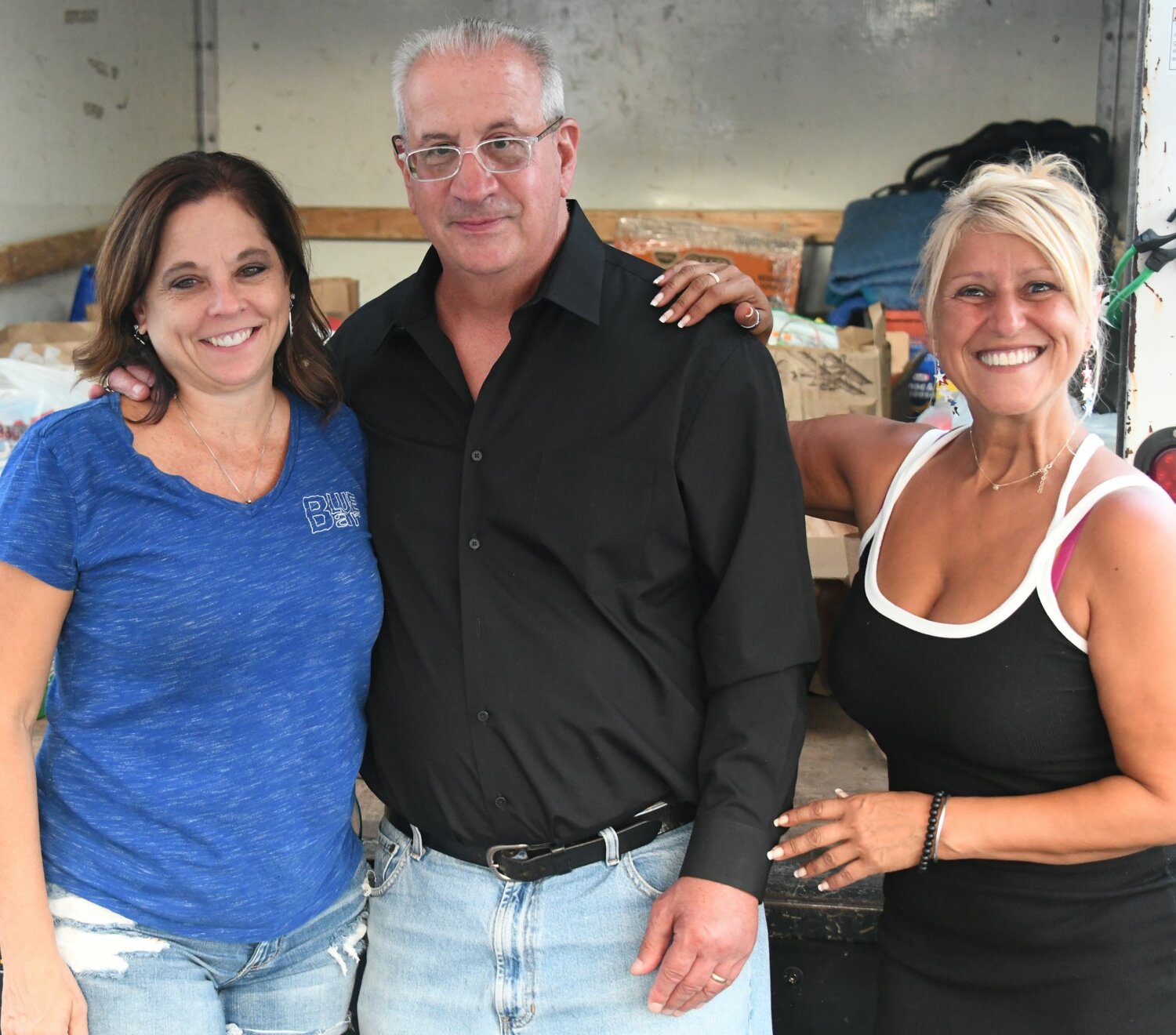 Theresa Drahovsky, Blue Bar owner, Mike Cerino, executive director of the Warminster Food Bank and Melody Latare, Warminster Food Bank personal assistant.