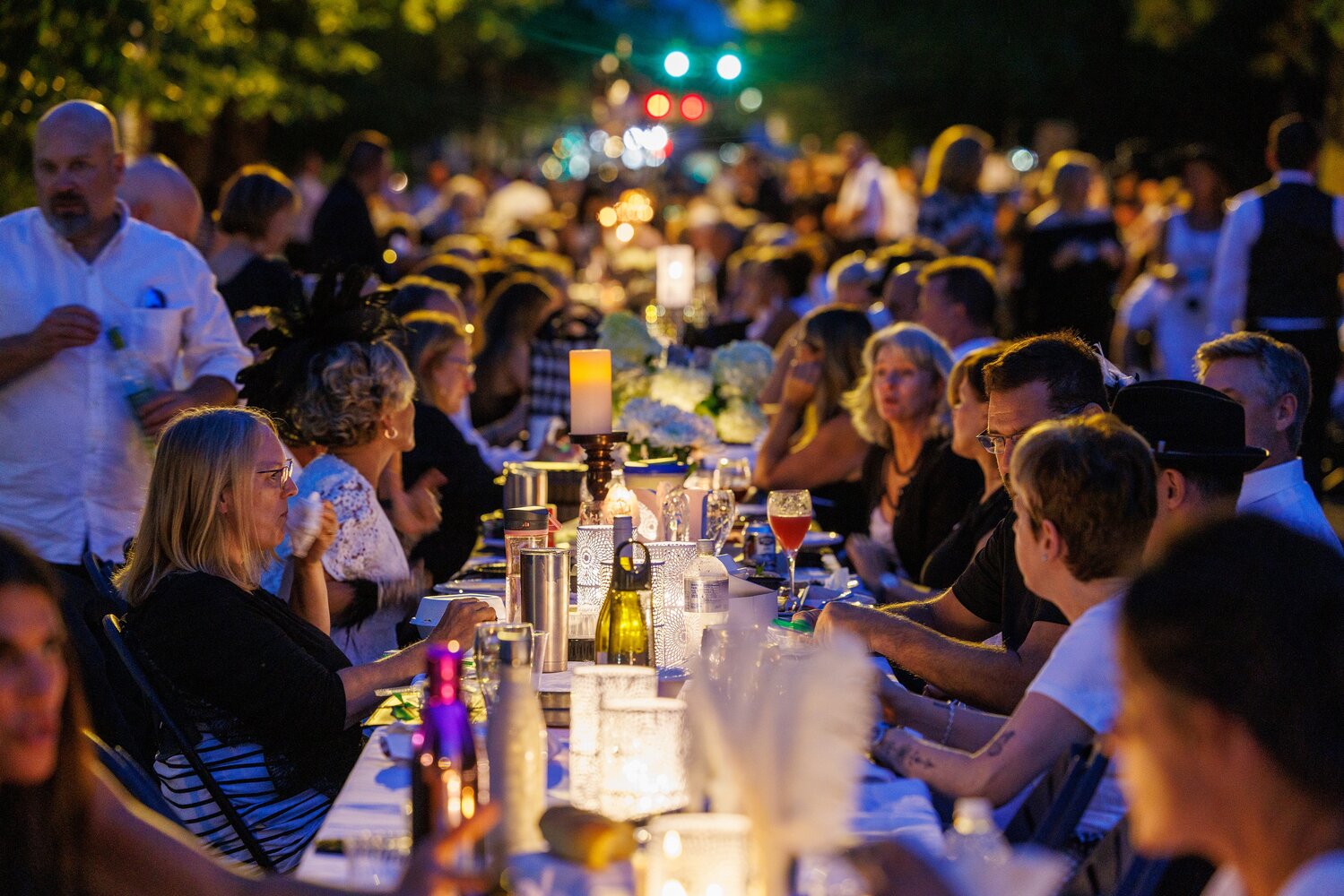 Dinners enjoy a previous Black & White Dinner to benefit the Newtown Theater.