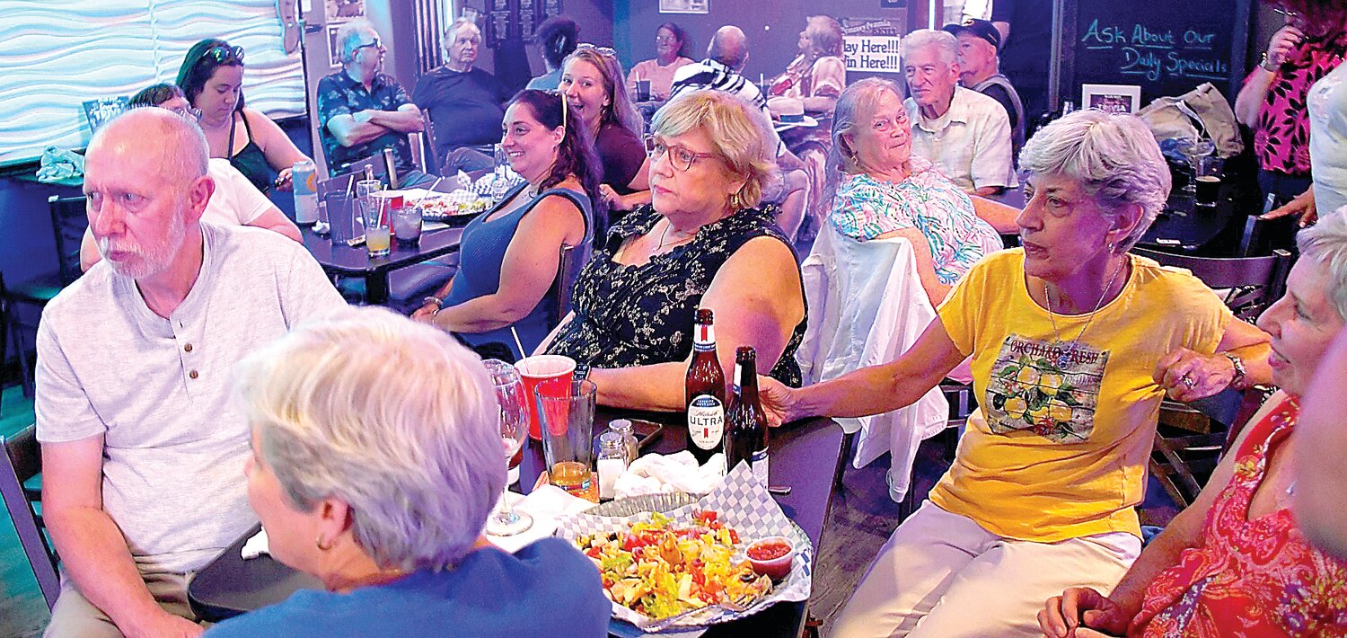 Folks enjoy food and drinks at the Warminster Food Bank fundraiser.