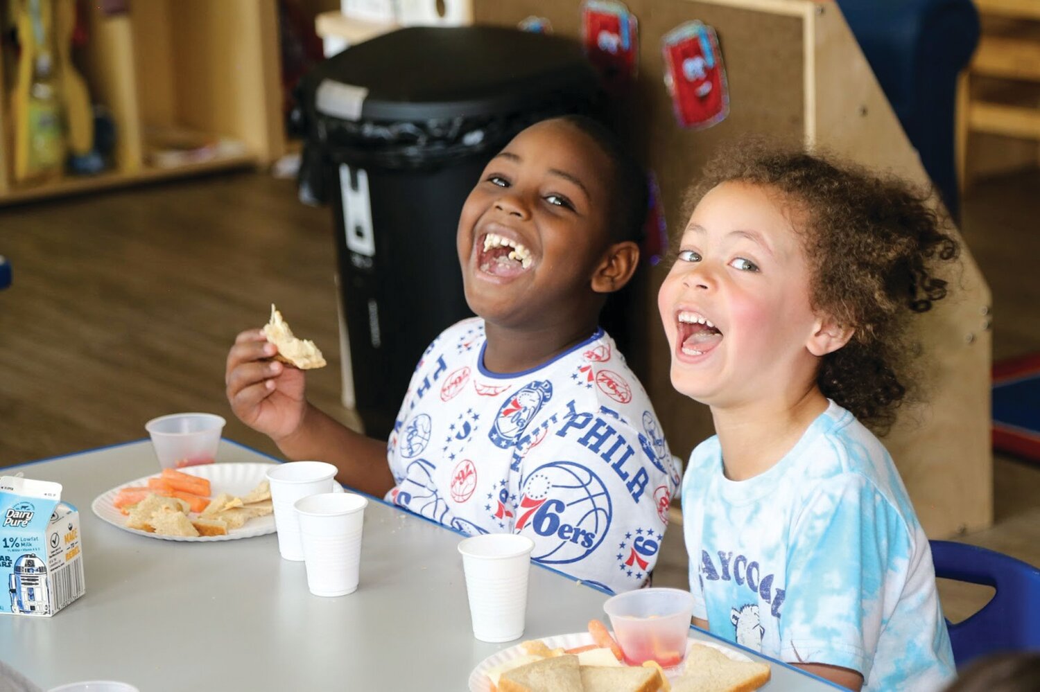 Students from the Pre-K Counts class at the Morrisville Child Care Center of River Crossing YMCA enjoy their healthy lunch served by volunteers from The GIANT Company on June 4.