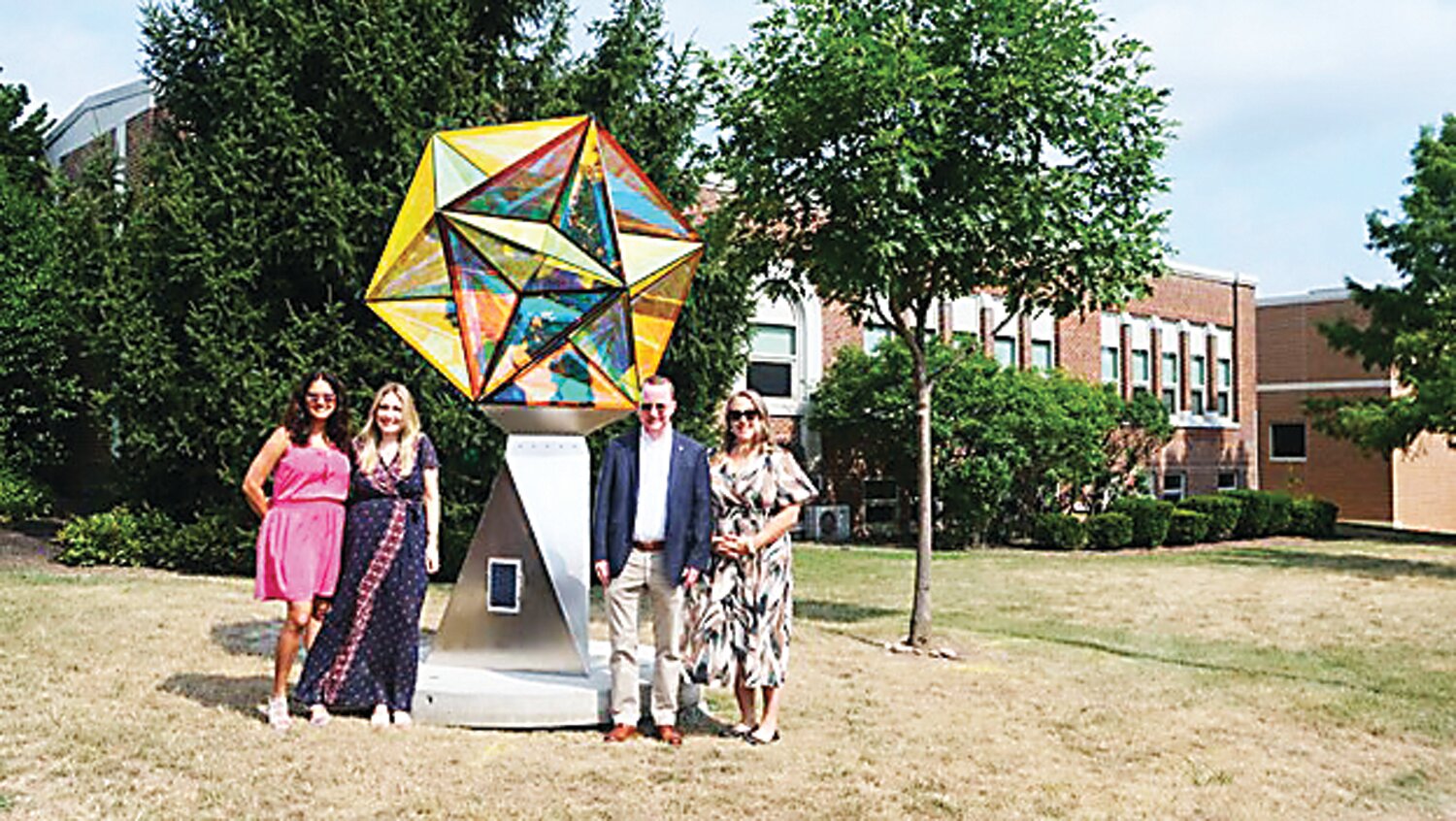 From left are: New Hope-Solebury Education Fund Co-Chairs Mita Heble and Kait Wilson, New Hope-Solebury School District Superintendent Dr. Charles Lentz, and New Hope Arts Executive Director Christine Ramirez, shown with “Dodecahedron Star” by artist Ray King.