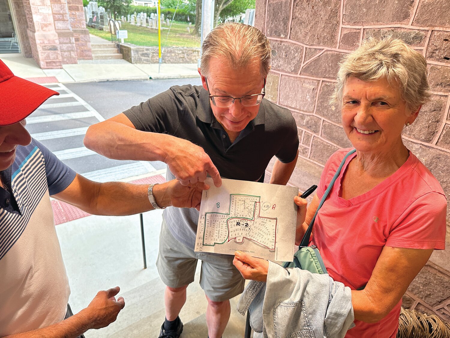 Doylestown Presbyterian Church (DPC) members Dennis Parenti, Jim Kmetzo, and Donna Line look over a map used to help volunteers distribute shopping bags to Doylestown residents during DPC’s first Community Food Collection. The food will directly help those facing food insecurity through the Bucks County Housing Group.