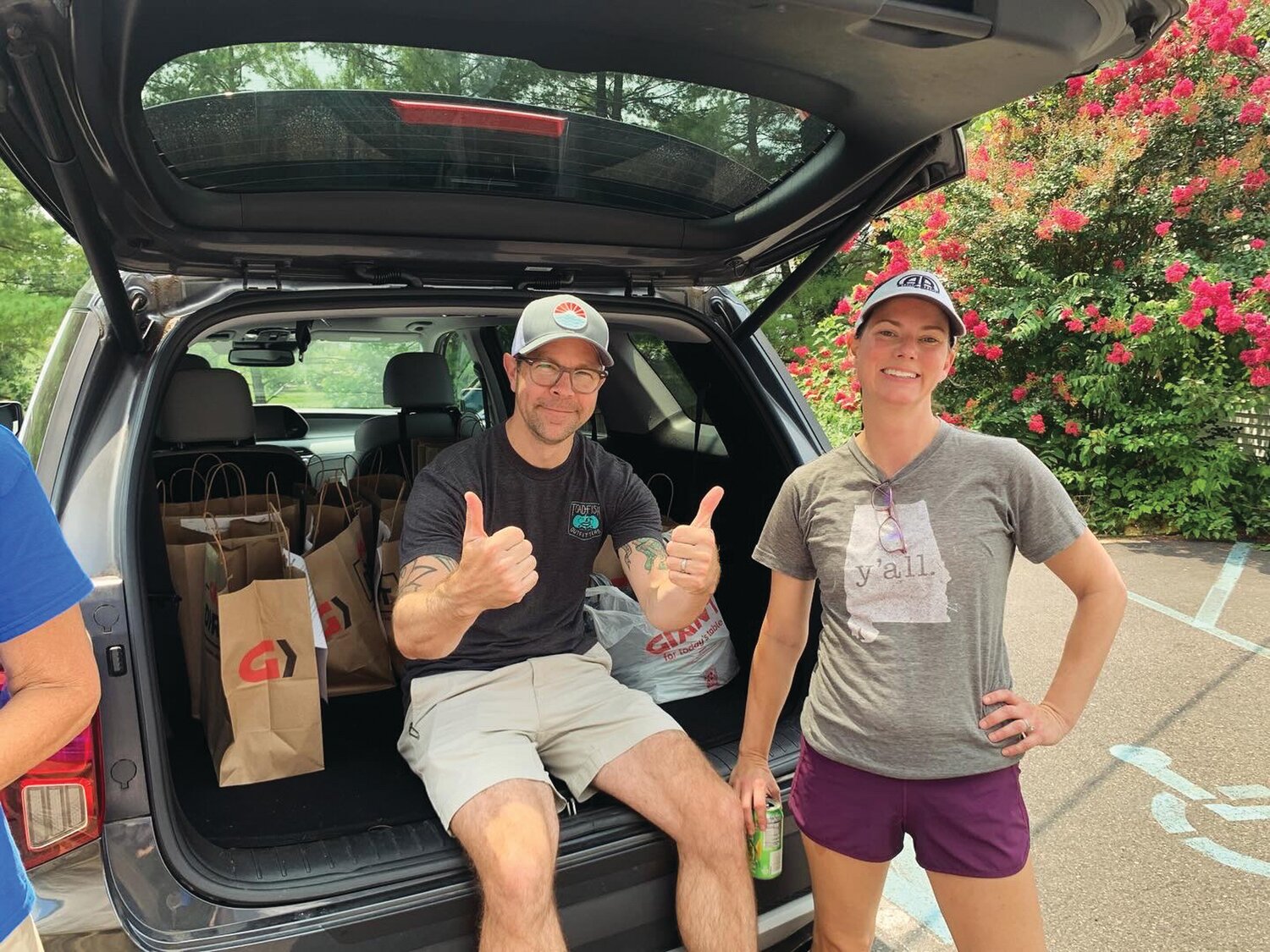 Doylestown Presbyterian Church (DPC) members Andy Benson and Tanner Benson deliver food to the Bucks County Housing Group’s Doylestown Food Pantry on July 28. Church volunteers picked up nearly 150 shopping bags filled with food by Doylestown residents during DPC’s first Community Food Collection.