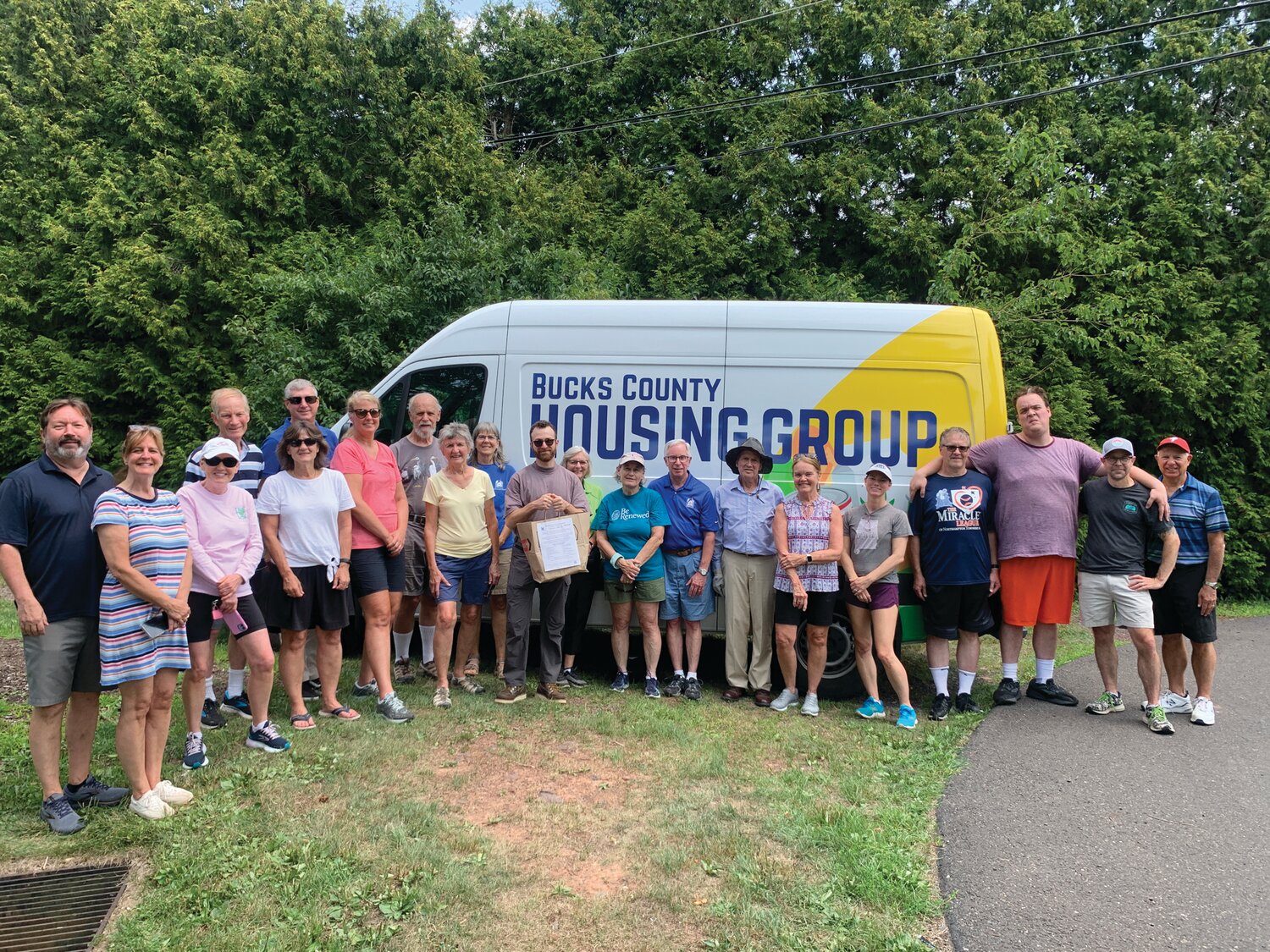 A group of Doylestown Presbyterian Church (DPC) members and friends smile for a photo after delivering nearly 150 shopping bags filled with food by Doylestown residents during the collection to benefit the Bucks County Housing Group’s Food Pantry.