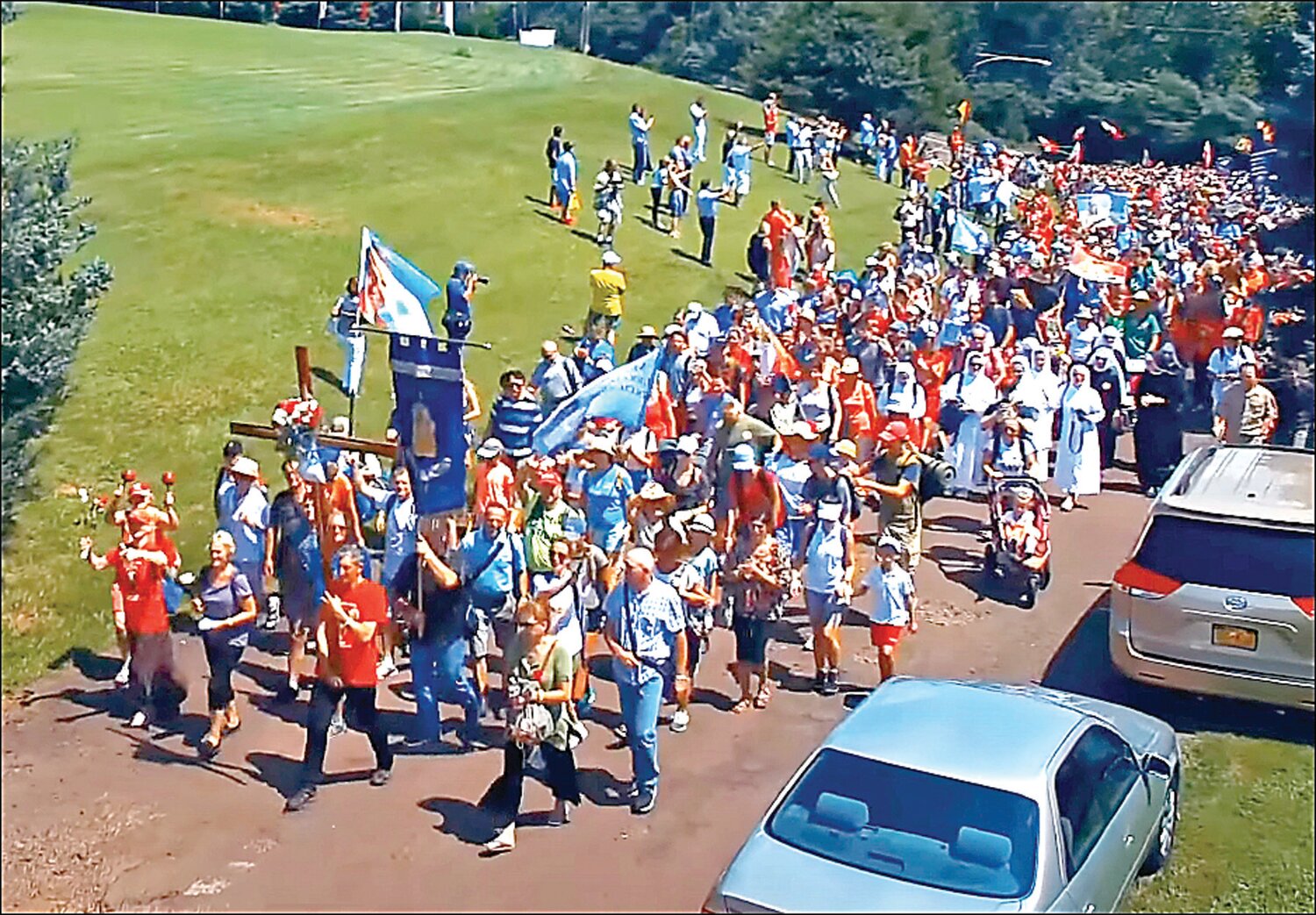 In a familiar August scene, pilgrims make their way to the National Shrine of Our Lady of Czestochowa in Doylestown Township. Walking pilgrimages from Great Meadows and Trenton, N.J. will take place between Aug. 8 and 11.