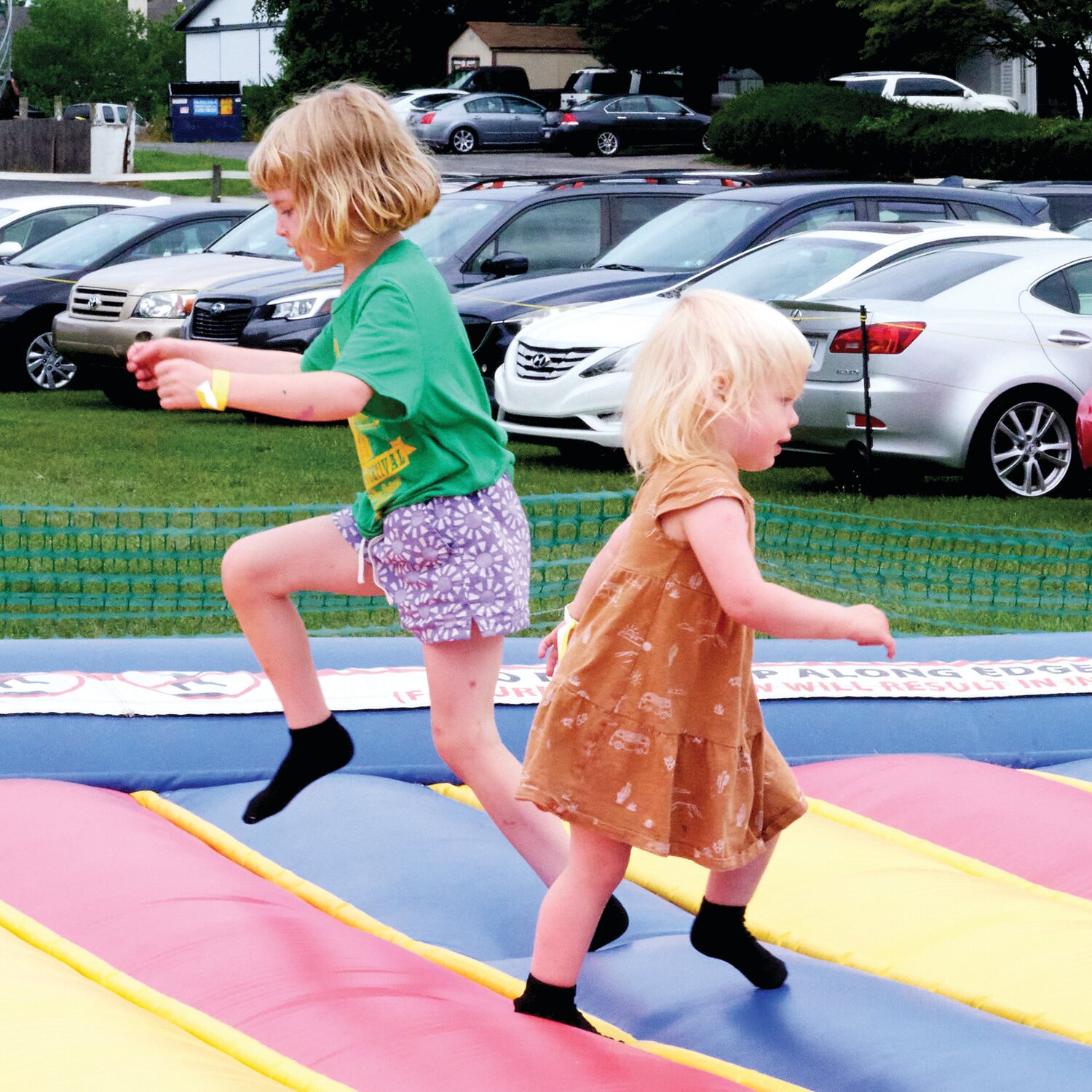 Autumn and June Pattley of Morrisville have fun during the Sweet Corn Festival Aug. 4 at Charlann Farms in Lower Makefield.