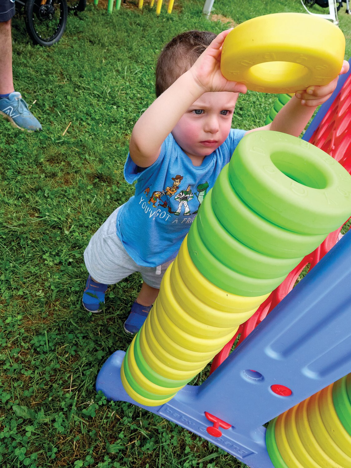 Rob Passaro of Newtown stacks rings during the Sweet Corn Festival held Aug. 4 at Charlann Farms  in Yardley.