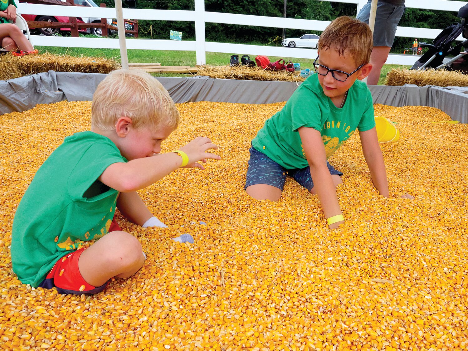 Children play in the corn pit during Charlann Farms’ Sweet Corn Festival.