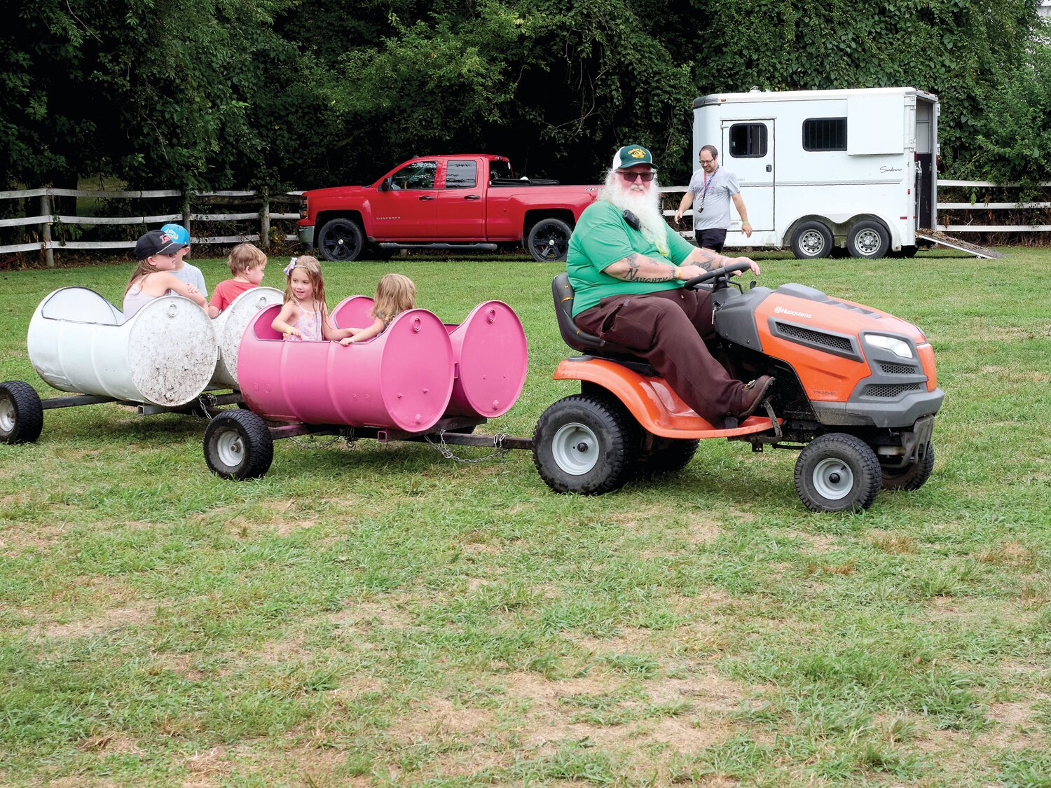 Children go for a ride during the Sweet Corn Festival at Charlann Farms in Yardley.