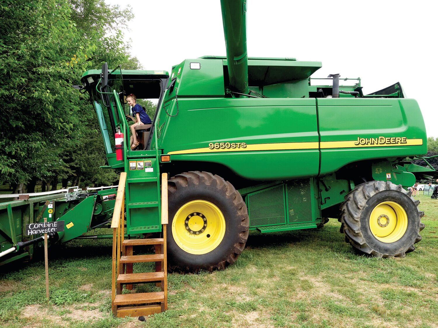 Amelia Umfer of Mt. Laurel, N.J., on the combine during the Sweet Corn Festival Aug. 4 at Charlann Farms.