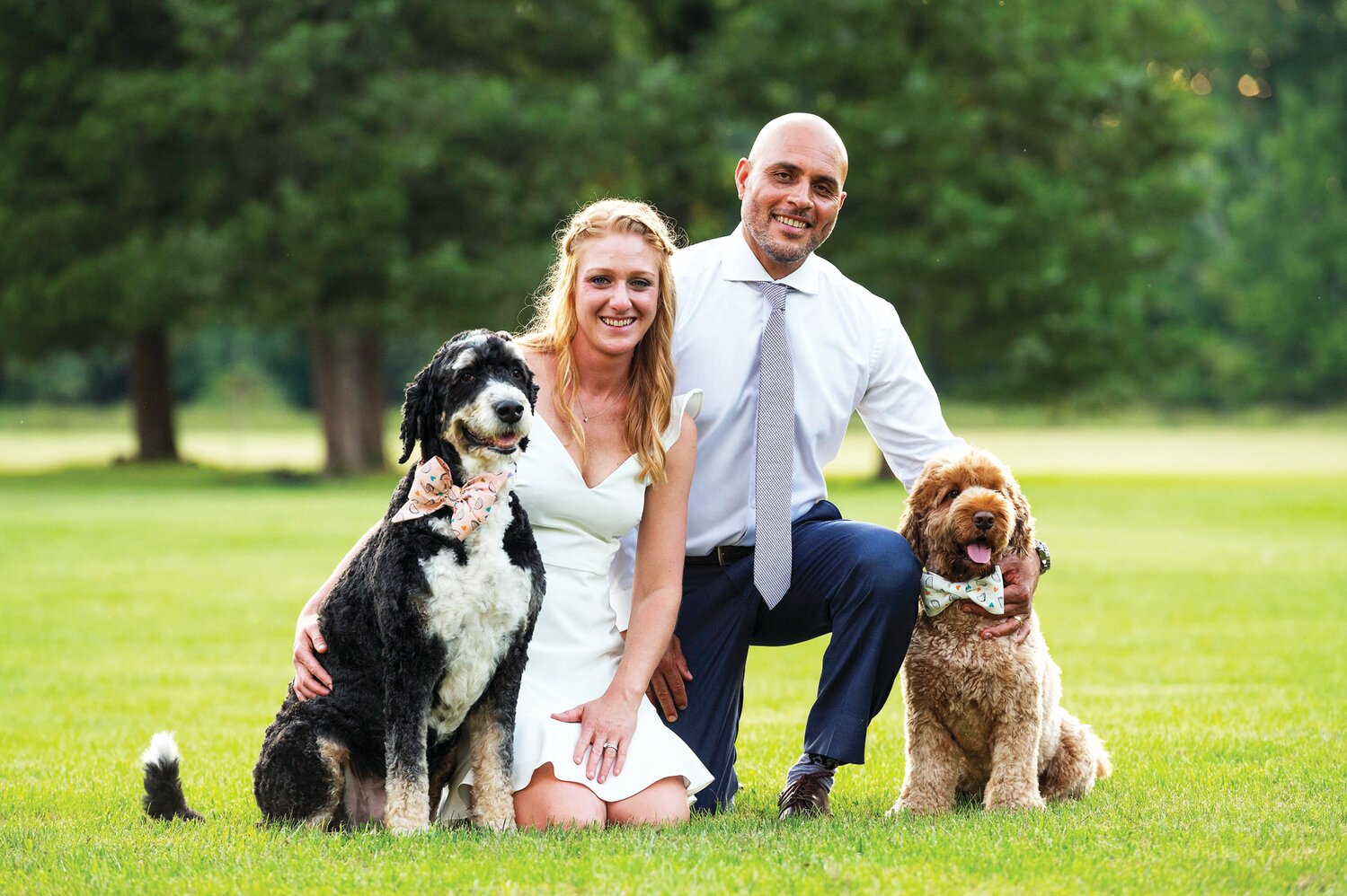 Amanda and Sean Rivera, owners of Absolute Canine, met when Amanda sought training for her dog, Persephone (Persey), left, a wayward bernedoodle. On the right is Leo, one of the couple’s two Australian labradoodles.