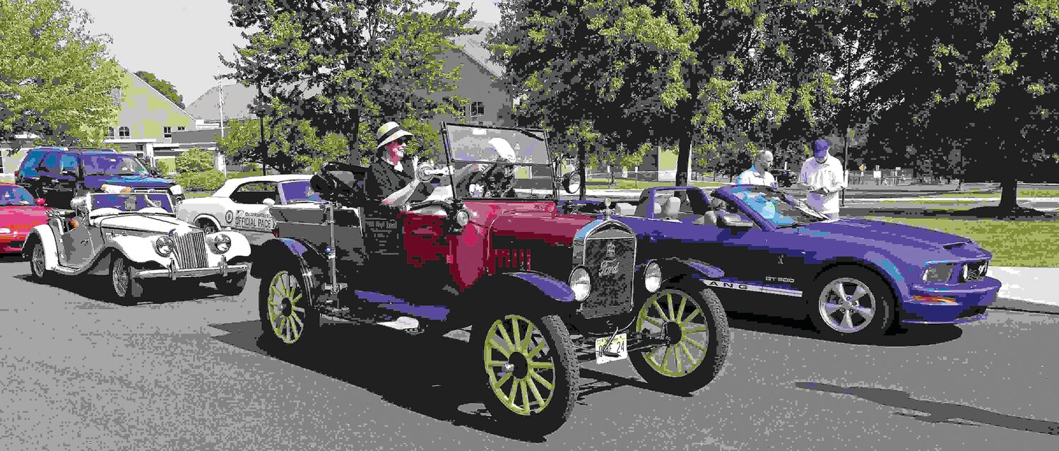 Vehicle await the start of the road rally.