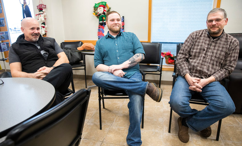 From left, Brian Rikstad, a veteran who lives in Rochester, Director of Veterans Journey Forward Jesse Lloyd and Veterans Memorial Museum Director Chip Duncan smile while talking about the service and support provided to veterans through peer counseling.