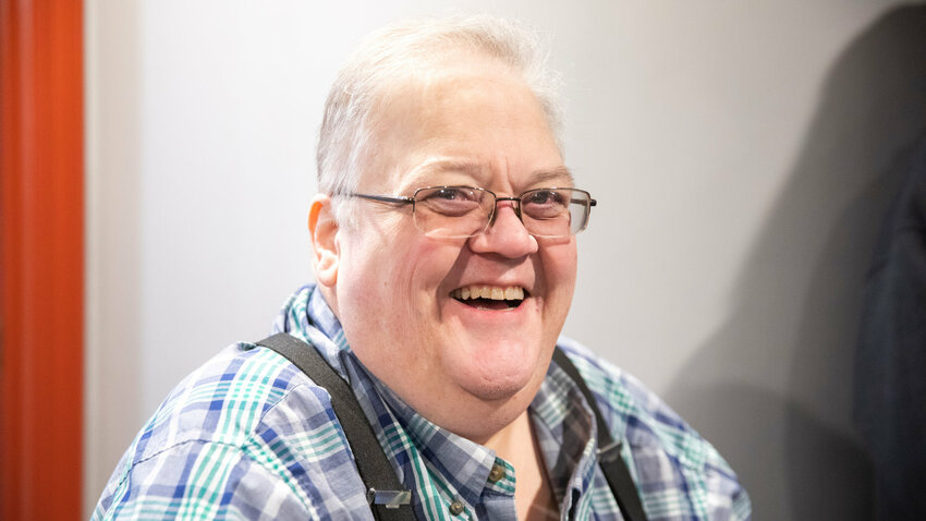 Daryl Lund smiles for a photo during a ribbon cutting ceremony in 2023.