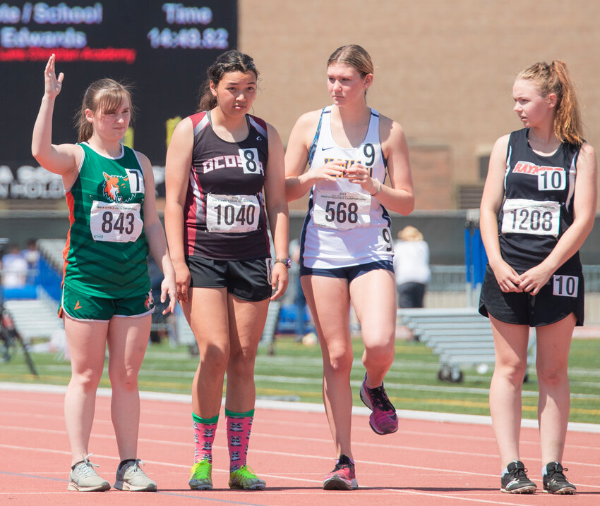 Morton-White Pass runner Ayricka Hughes waves when her name is announced ahead of the 2B girls 3200 meter run State finals in Yakima on Saturday, May 27.