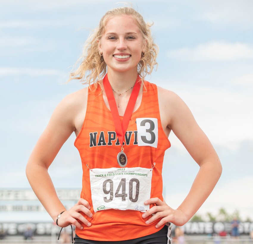 Napavine’s Morgan Hamilton smiles for a photo with her silver medal for the 2B girl 200 meter dash State championship in Yakima on Saturday, May 27.