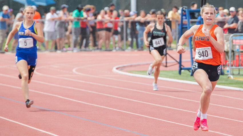 Napavine’s Morgan Hamilton passes Adna’s Reagan Naillon and Morton-White Pass runner Madyson Bryant in the 2B girls 400 meter dash State finals in Yakima on Saturday, May 27.