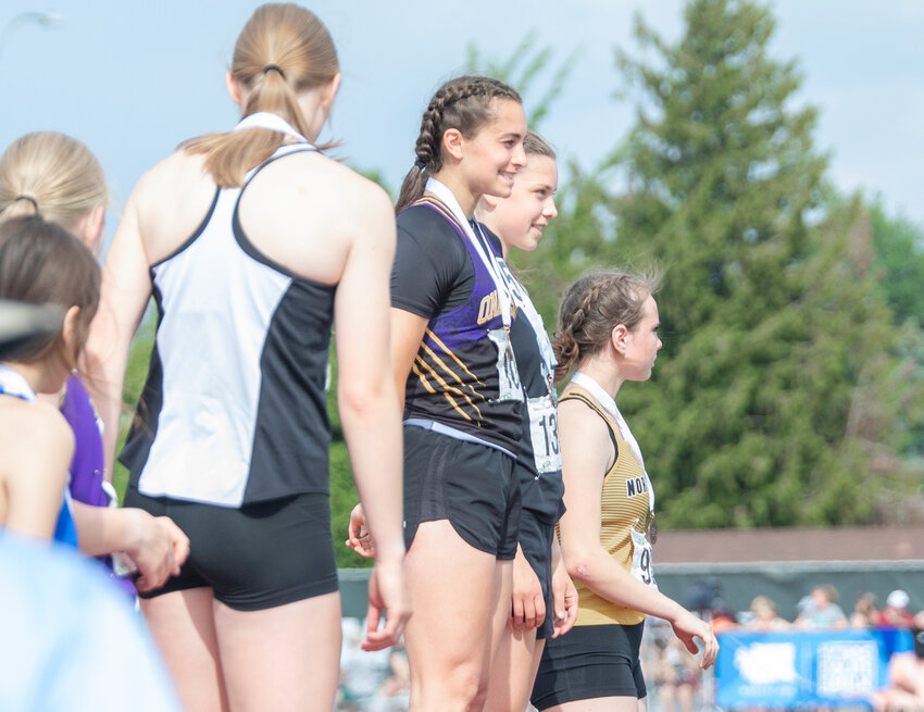 Onalaska’s own Harvard-bound track athlete Brooklyn Sandridge smiles with her bronze medal for the 2B 300M hurdles at the State track and field meet in Yakima on Saturday, May 27.