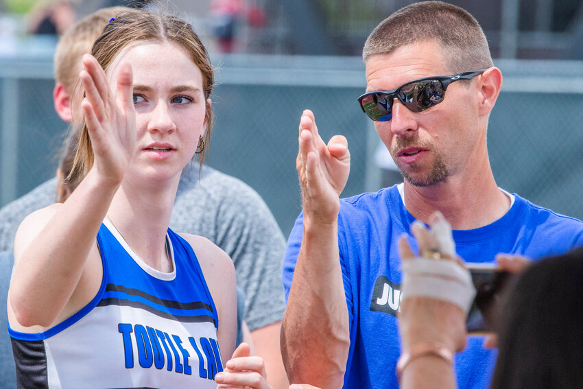 Toutle Lake’s Layni Brandhorst talks to her coach before taking second in the Javelin event during the 1A/2B/1B State track and field meet in Yakima on Saturday, May 27.