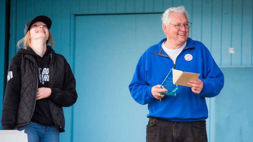 Lee Coumbs reacts as he receives a surprise award for 40 years of service at the Southwest Washington Fairgrounds.