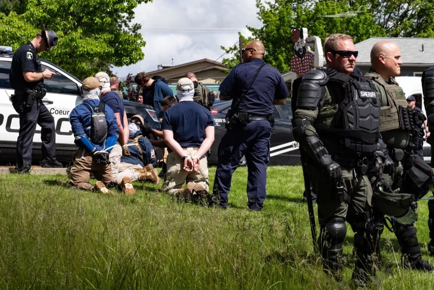 A group of 31 men with the white supremacy group Patriot Front were removed from the back of a U-Haul rental truck and arrested after a traffic stop by multiple law enforcement agencies on Northwest Boulevard in Coeur d&rsquo; Alene. The stop was made just a few blocks from where the &ldquo;Pride in the Park&rdquo; event was being held in Coeur d&rsquo;Alene City Park, Saturday, June 11, 2022. Police say the men, dressed similarly, had shields and other gear and were intending to riot in downtown Coeur d&rsquo;Alene. (COLIN MULVANY/THE SPOKESMAN-REVIEW (TNS)