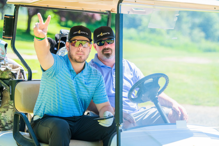 Brady Calkins sports a Par4Sports hat after teeing off during a charity tournament at Riverside Golf Course in Chehalis in 2022.
