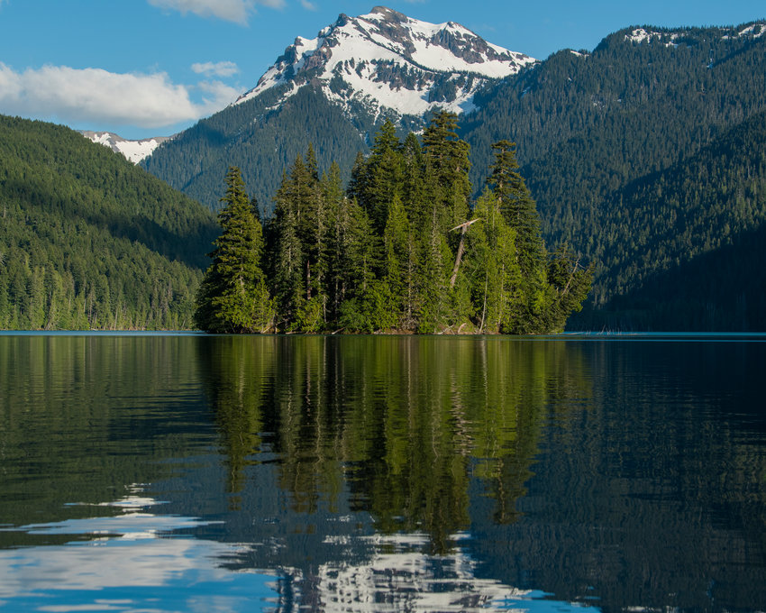 The Goat Rocks and Agnes Island are reflected back onto Packwood Lake in July 2022.