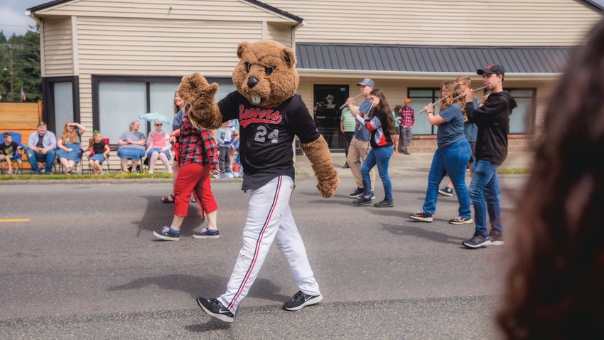 The Beavers mascot waves while walking in the Oregon Trail Days parade in July 2022 in Tenino.