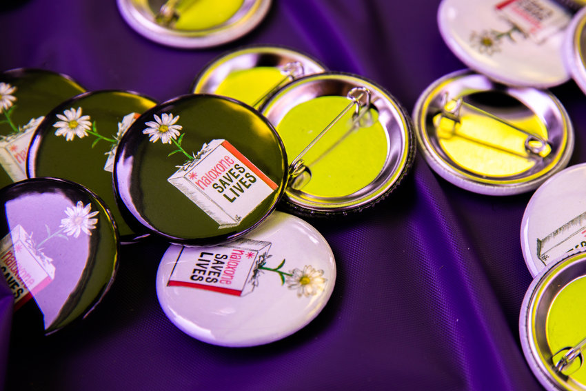 Pins read, &ldquo;Naloxone Saves Lives,&rdquo; at George Washington Park in Centralia during an Overdose Awareness event in 2022.