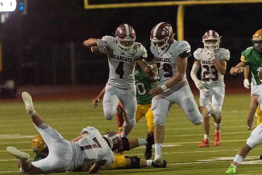 Gage Brumfield goes airborne to get extra yardage during W.F. West's 28-7 win over Tumwater on Sept. 30, 2022.