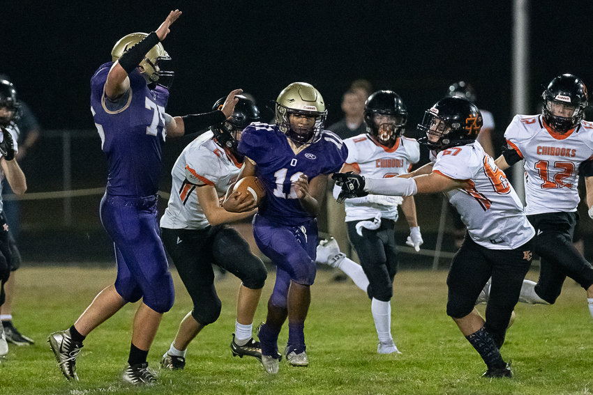 Onalaska tailback Rodrigo Rodriguez bursts through a hole on a kick return in Ony's 48-30 win over Kalama Oct. 6.