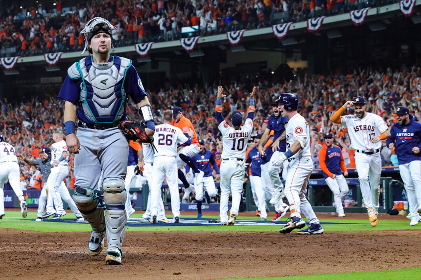 Cal Raleigh (29) of the Seattle Mariners reacts after a walk-off home run was hit by Yordan Alvarez (44), not pictured, of the Houston Astros during the ninth inning in Game One of the American League Division Series at Minute Maid Park on Tuesday, Oct. 11, 2022, in Houston. (Carmen Mandato/Getty Images/TNS)