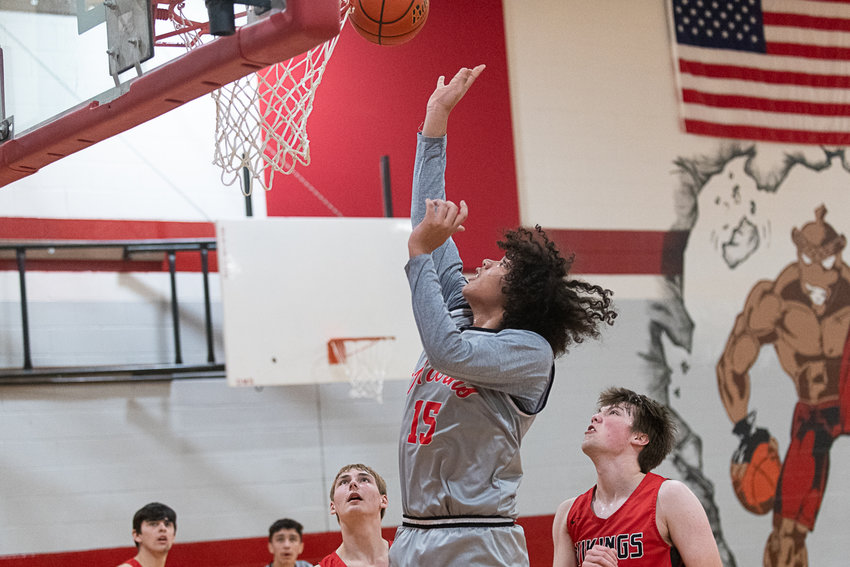 Courtney Price puts in two points in the post during the first half of Oakville's 74-61 win over Mossyrock in the semifinals of the 1B District 4 tournamnet on Feb. 15.