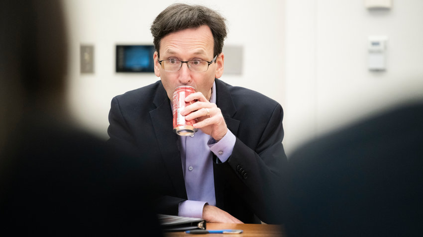Attorney General Bob Ferguson prepares to talk with members of the press during a legislative meeting inside the John A. Cherberg building in Olympia last February.