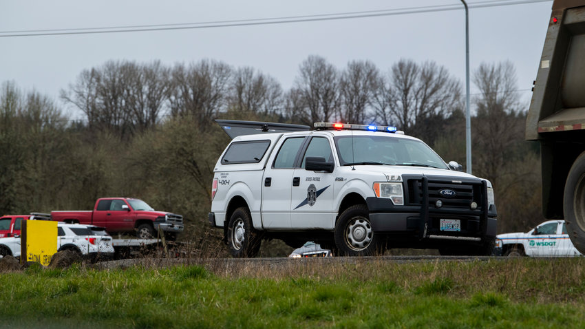 Members of the Washington State Patrol respond with the Washington State Department of Transportation to a scene in Adna last March.
