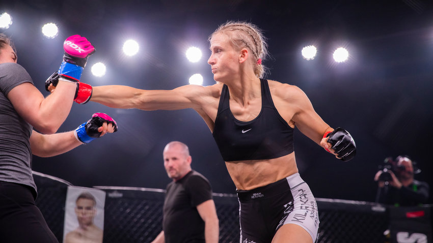 Kayla Weed throws a flurry of punches in front of a sold out crowd at the Muckleshoot Casino while fighting Rose Fujinaka in February 2023.