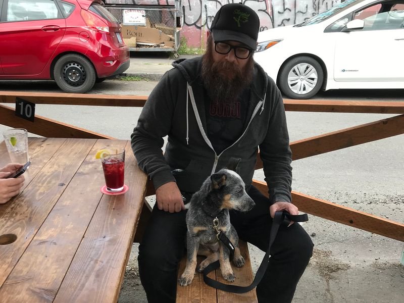 Aron Christensen and his dog, Buzzo, are pictured in this photo previously provided to The Chronicle by his family.