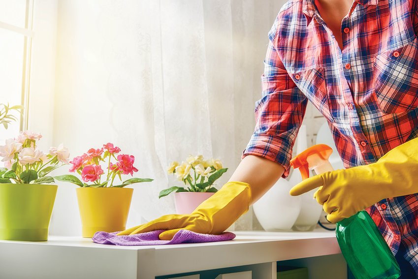 A person cleans their countertop in this photo provided by MetroCreative Circle.