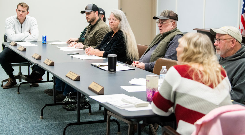 FILE PHOTO &mdash; Mayor Dan Mortensen listens to a presentation from Kris Camenzind, executive director of the Hope Alliance, during a presentation at a city council meeting earlier this year.