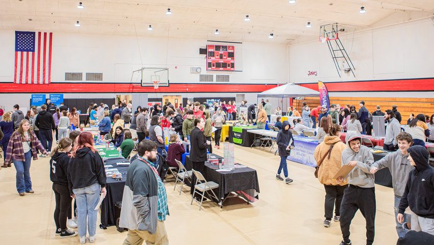 Students walk through Tenino High School&rsquo;s college and career fair in the gymnasium Thursday morning.