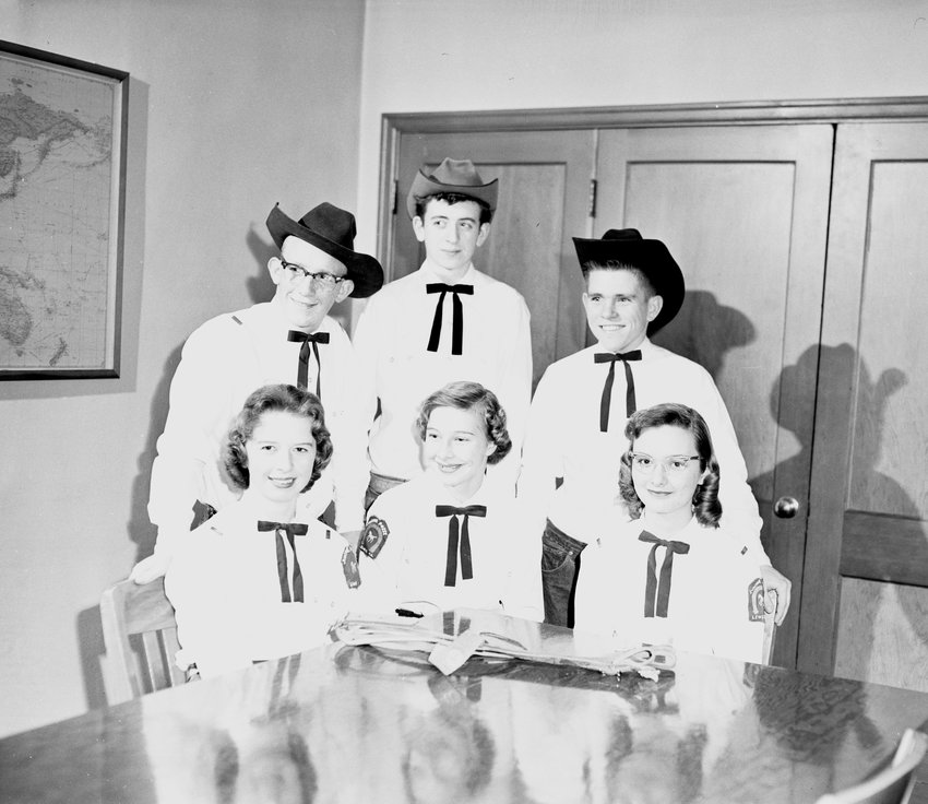 FROM THE ARCHIVES: This undated caption with this photo stated, “Lewis County Junior Posse installed newly elected officers, Saturday evening at dinner in the Centralia Elks lodge. Pictured left to right are: Seated, Karol Johnson, Lieutenant; Karen Gutschow, secretary; Roberta Parke; lieutenant; standing, John Hughey, president; Jerry Smith, treasurer; and Gary O’Connor, captain, all of Centralia. The posse, now in its fifth year, has 45 members and takes part in many activities including parades and camping trips.  Parents of members form the advisory board with Gene Johnson serving as supervisor to the Posse.” From the State Library Photograph Collection, 1851-1990, Washington State Archives.