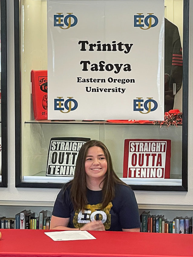 Tenino&rsquo;s Trinity Tafoya poses during a signing ceremony to commit to wrestle for Eastern Oregon University.